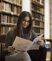 Student Reading In Library 2