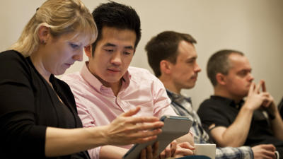 Delegates using tablet