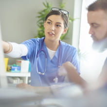 Doctors using computer