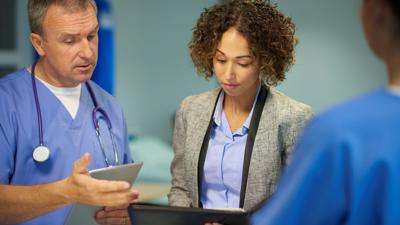 Doctors looking at notes