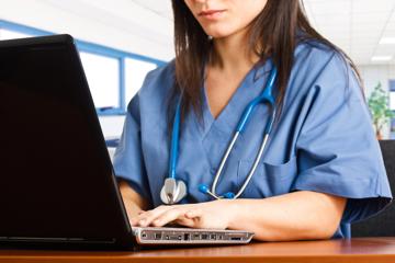 Doctor using laptop
