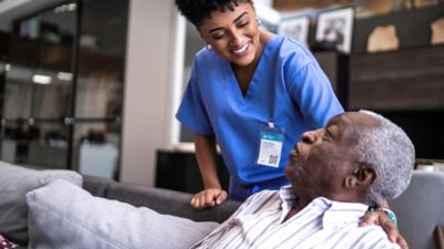 Healthcare worker with patient